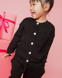 Baby Kids Bamboo Pajamas — Black Ribbed Knit Button Sweater — Image 1