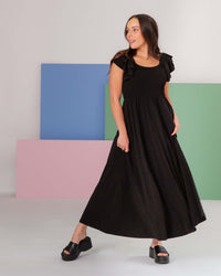 Baby Kids Bamboo Pajamas — Black Women's Cap Sleeve Dress — Image 1