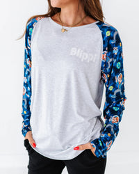 Baby Kids Bamboo Pajamas — Blippi™ in Space Adult Unisex Long Sleeve Raglan T-Shirt — Image 1