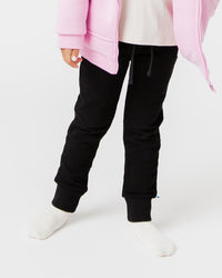 Baby Kids Bamboo Pajamas — Black Relaxed Fit Sweatpants — Image 1