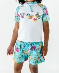 Baby Kids Bamboo Pajamas — Go With The Float Boys Swim Shorts — Image 1