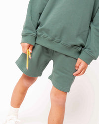 Baby Kids Bamboo Pajamas — Chalkboard Green Varsity Shorts — Image 1
