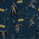 Pattern of Batman characters and yellow Batman logos on a dark background